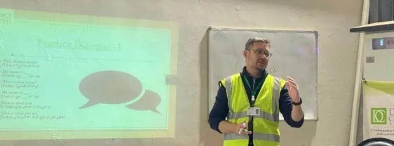 A trainer leading a practice dialogue session