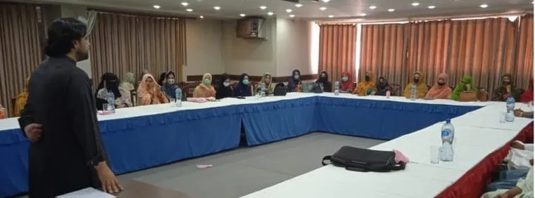 Participants seated around a boardroom table during a workshop